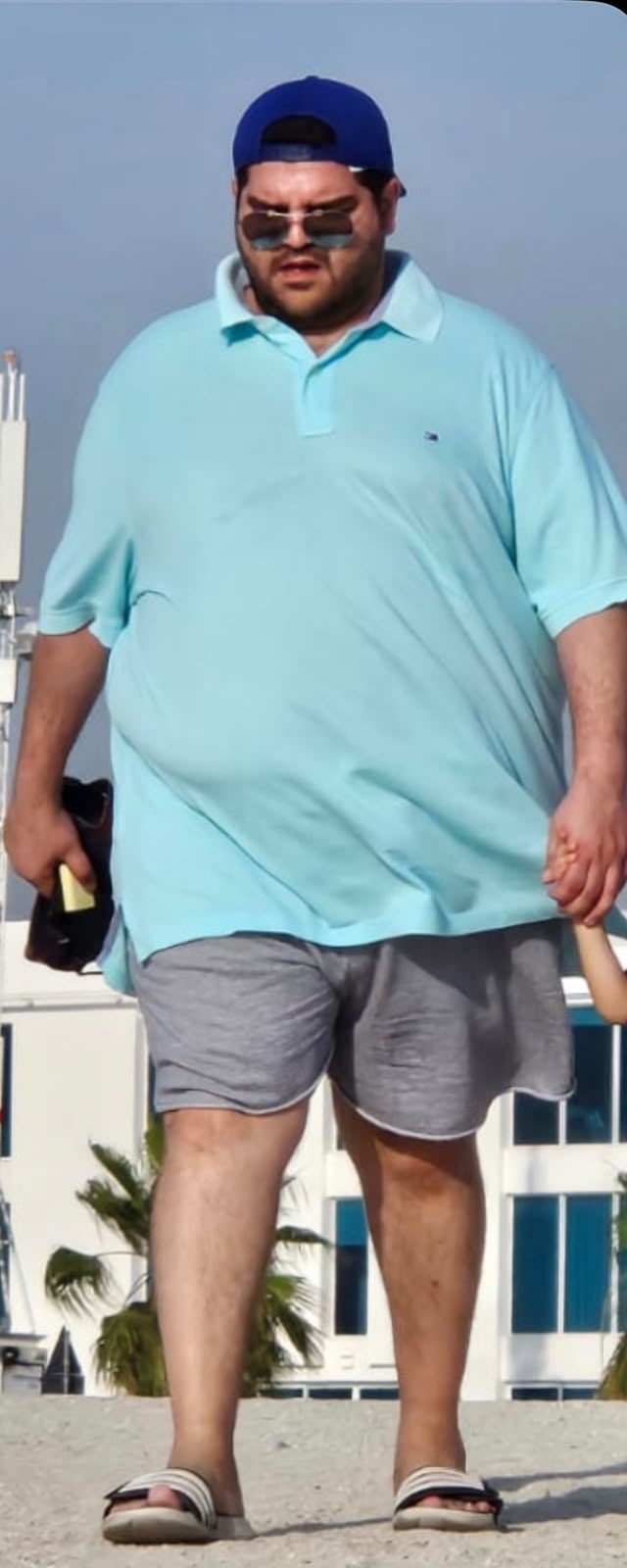 Karim at his heaviest, walking on a Dubai beach